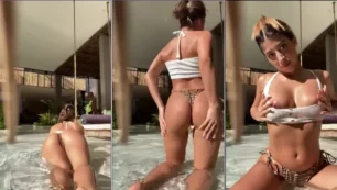Shannonsinghof, uma mulher linda de cabelos escuros, está curtindo na beira da piscina exibindo a calcinha enfiada no bumbum